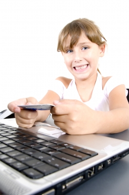 girl with credit card and computer