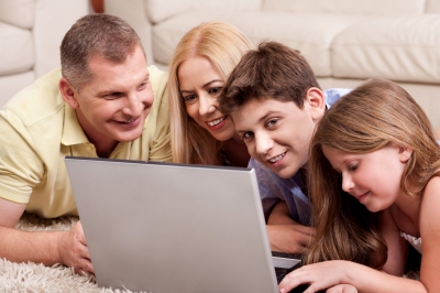 family playing computer with kids
